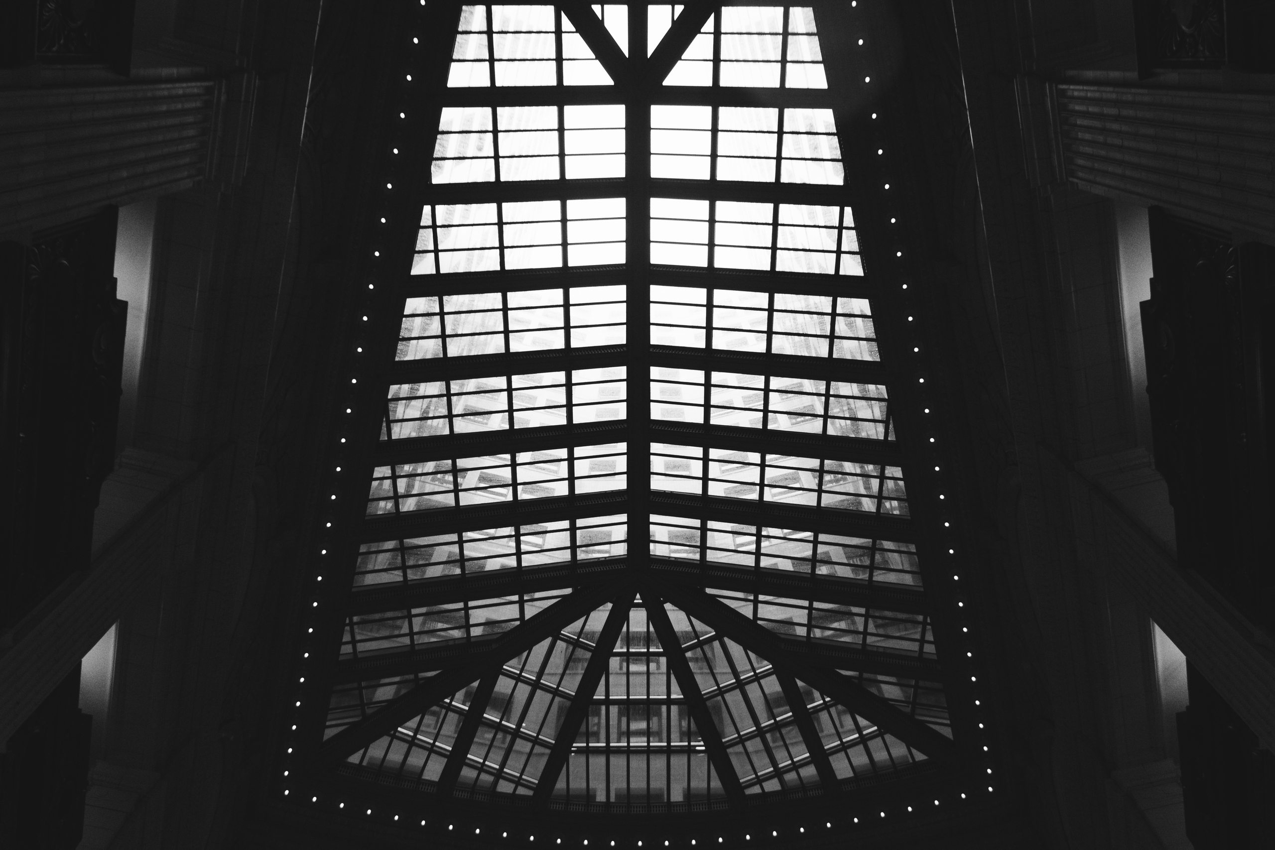 A glass ceiling in black and white as someone asks does a blog help SEO.